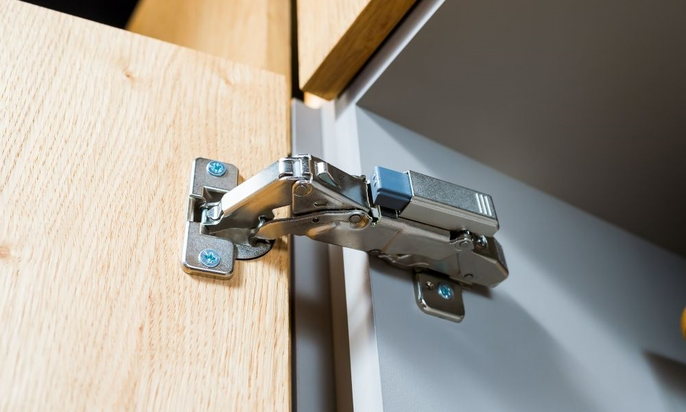 Image of concealed hinge in cabinet
