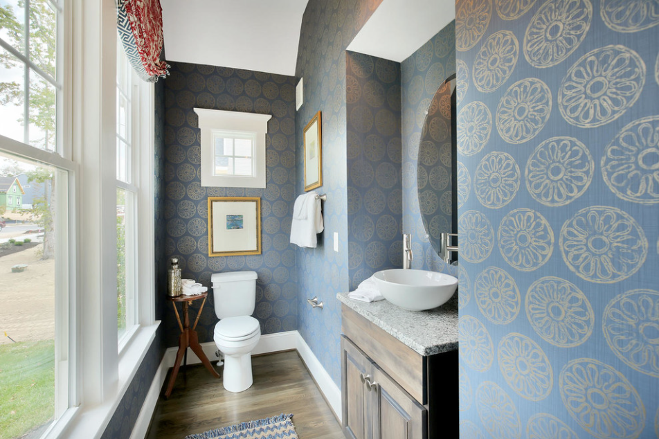 Although small, this powder room is packed with style. The vessel sink and mat