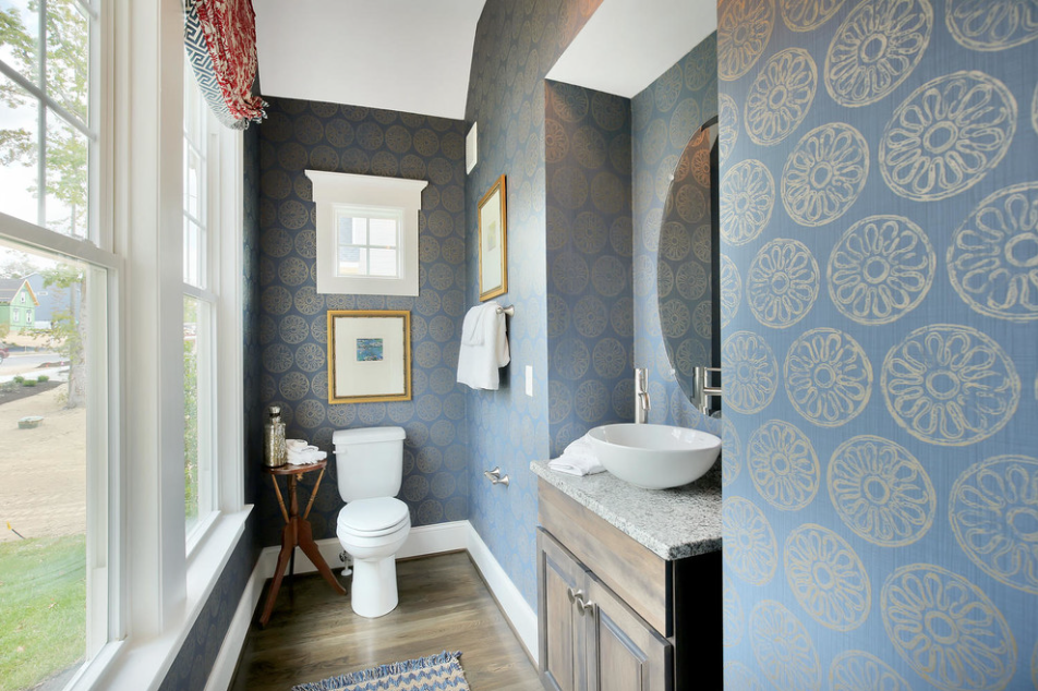 Although small this powder room is packed with style The vessel sink and mat