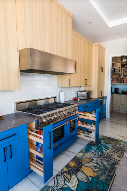 Bold blue cabinets create a big design statement, but the organizers tell the real story