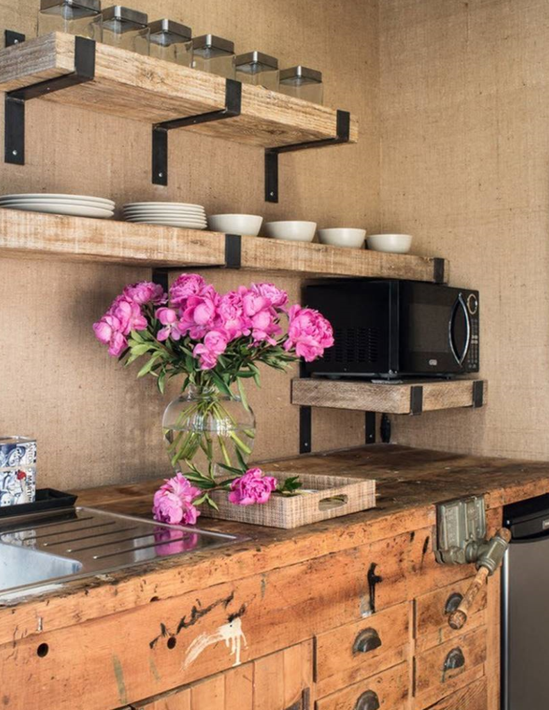 Rustic kitchen using old barn wood and iron hardware