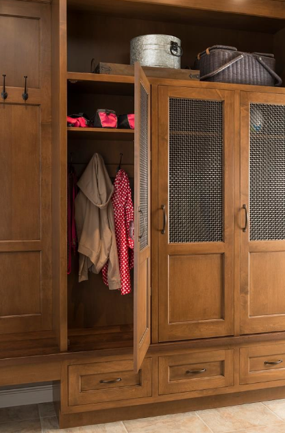 Mudroom closet space complete with hooks handles and mesh screen door inserts