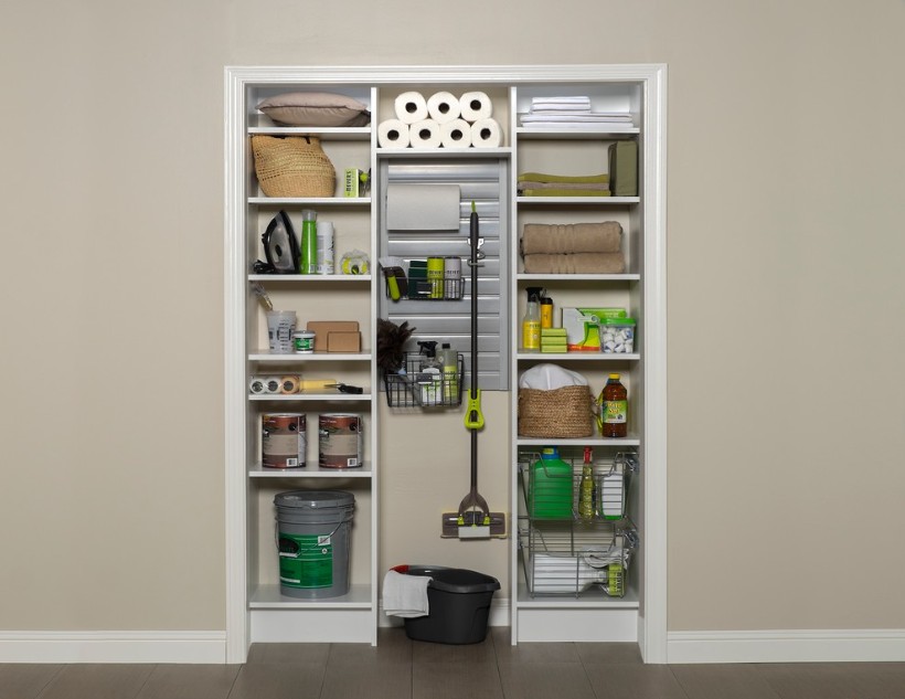 Cleaning supplies closet organized with slat wall and pull out baskets