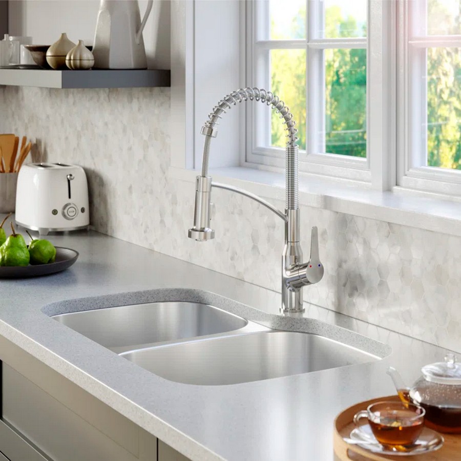 Kitchen sink with faucet in front of window