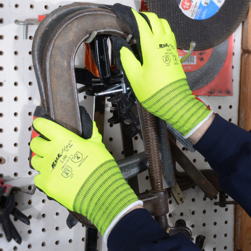 504877 Woodworker Express Blog Person in neon safety gloves using a large C clamp to tighten a metal piece in a workshop setting