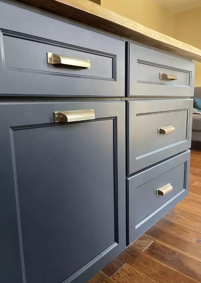 Cup Pulls Woodworker Express Blog Blue kitchen cabinets with brushed metal handles featuring drawers and a tall panel cabinet over a wooden floor