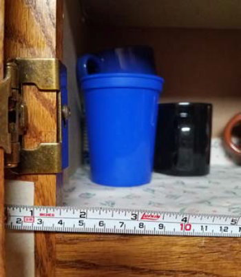 Figure 3 - Measure the distance from the edge of the tape to the door frame opening.