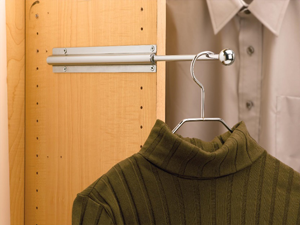 Valet rod holding a green sweater on a hanger